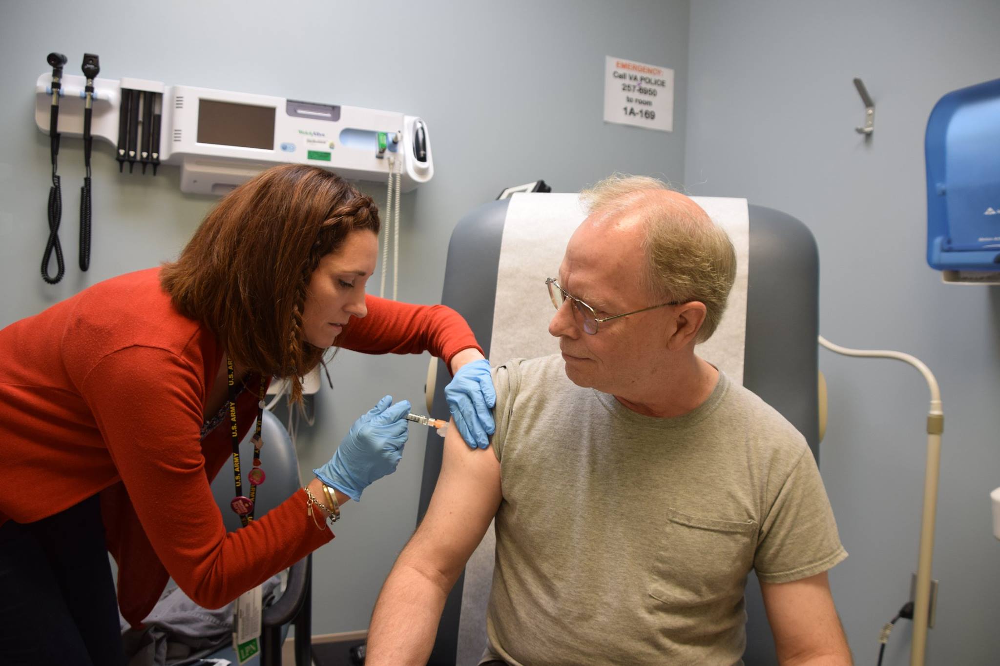 A medical professional administers a vaccine to a patient.