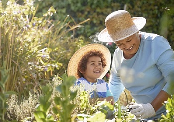 A Veteran gardening with her grandson 
