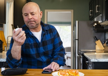 A Veteran reading over his prescription