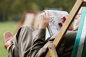 A Veteran doing a cross word puzzle