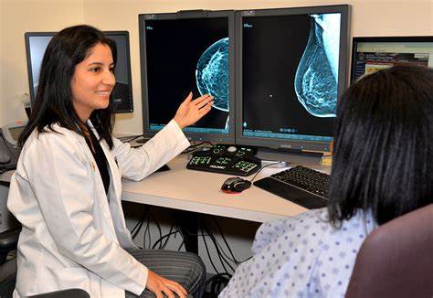 A doctor reviewing a mammogram 