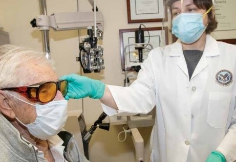 A Veteran having an eye exam with his doctor