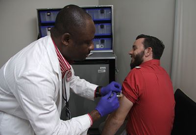 A man receives a flu shot