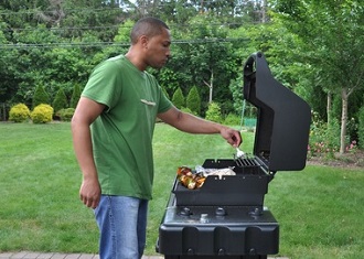 A Veteran using the grill