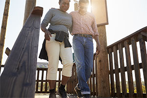 Mature Couple Walking On Platform Together