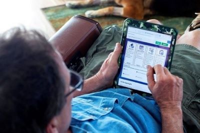 A man using My HealtheVet on a tablet device