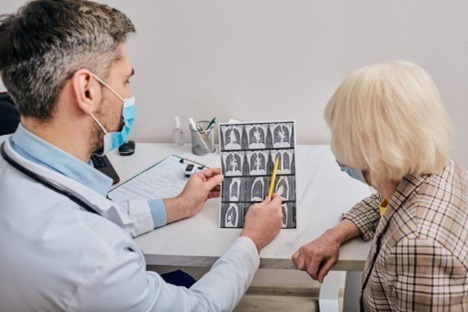 A Veteran reviewing their x-rays with a VA health care provider