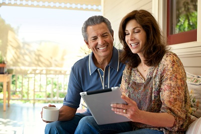 Couple viewing medical records on tablet