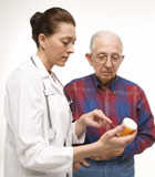 doctor explaining medication to veteran male