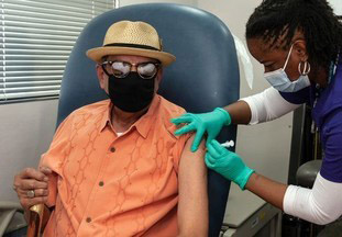 A Veteran getting his vaccine