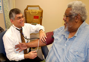 A Veteran talking to his doctor at a VA facility 