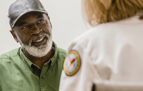 Veteran talking to a doctor about prostate cancer screenings