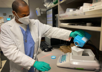 A pharmacist fills a prescription