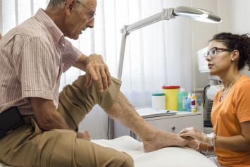 A Veteran having his foot examined by his doctor