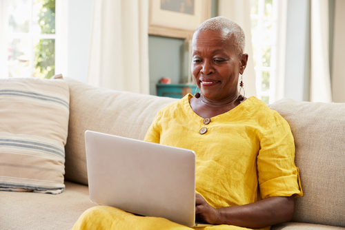 A Veteran learning how to upgrade her My HealtheVet account at home