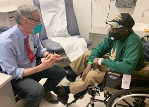 Veteran with his doctor at a VA medical center