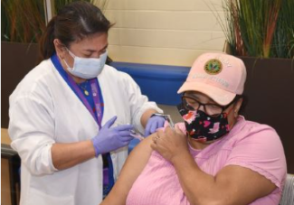 Woman receiving COVID-19 vaccine