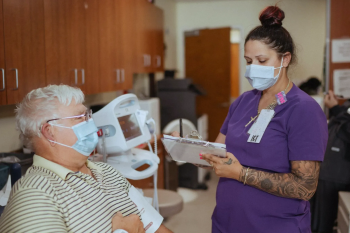 A Veteran talking to a member of his health care team