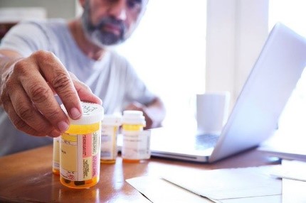 A Veteran looking at medications