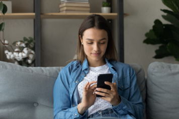 A Veteran checking her lab results on her phone at home
