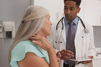  Veteran meeting with doctor about her neck pain