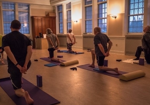 Veterans practicing yoga in a studio