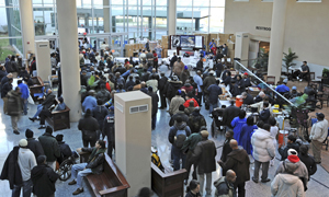 Medical center atrium filled with Veterans for a standown event