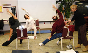 Yoga class at the VA in San Diego showing two instructors