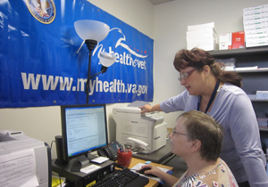 Two women sitting at a computer using My HealtheVet