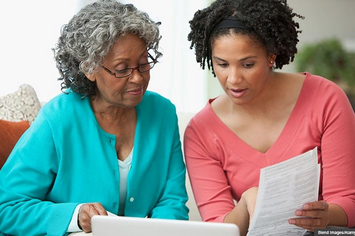 A Veteran going over her advance directive with a family member