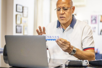 A Veteran reviewing his medication supply at home 