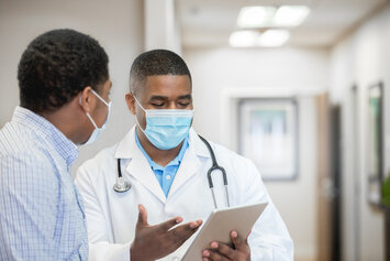 A Veteran and his doctor discussing his medical care