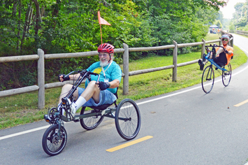 Two veterans riding bikes on a sunny day