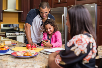 A Veteran family preparing lunch in their kitchen