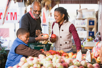 A Veteran and their family picking healthy foods to boost immune health