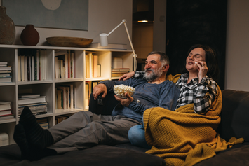 A Veteran and their partner enjoying an evening at home 