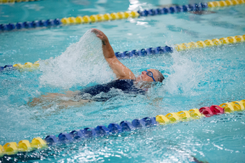 A Veteran swimming laps in a pool